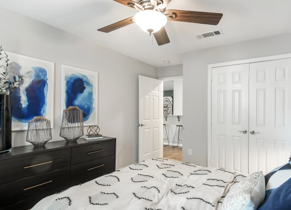a bedroom with a bed and a ceiling fan at Parkwest Apartment Homes, Mississippi, 39402
