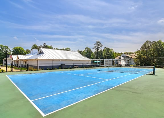 the tennis court at the whispering winds apartments in pearland at The Woodlands Apartment Homes, Mississippi