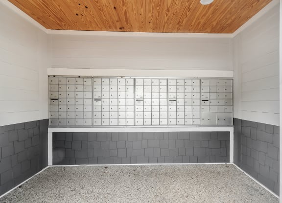 an empty room with a tile wall and a wood ceiling at The Woodlands Apartment Homes, Meridian, 39301