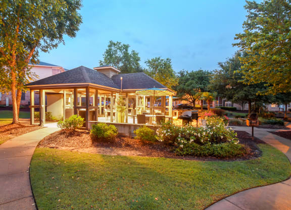 a park with a gazebo and a sidewalk at Ashford Place Apartment Homes, Flowood, Mississippi