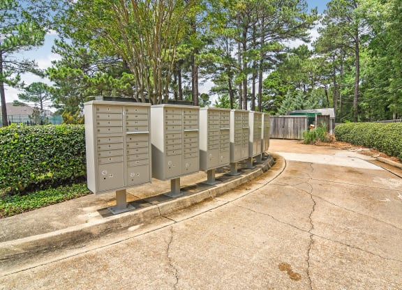 a row of mailboxes sitting on the side of a road at Lakeshore Pointe Apartment Homes, Brandon, MS, 39047