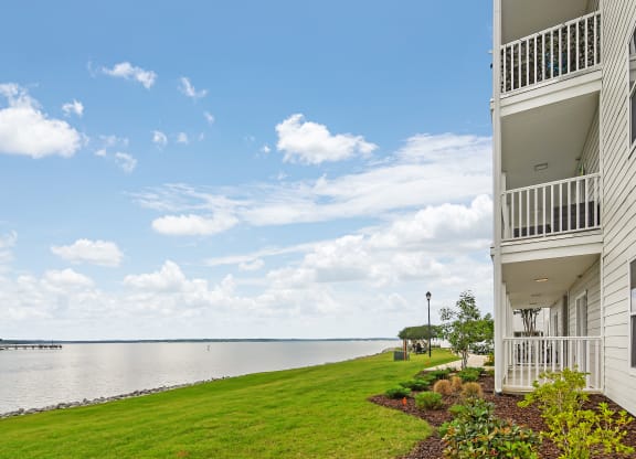 the view of the water from a balcony of a house at Lakeshore Pointe Apartment Homes, Brandon, 39047
