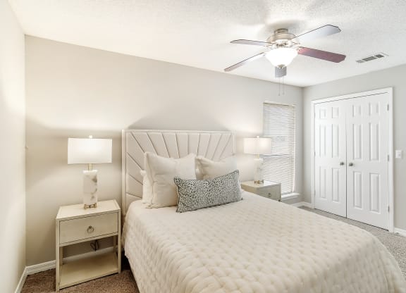 a bedroom with a large bed and a ceiling fan at Lakeshore Pointe Resort Apartment Homes, Brandon, 39047