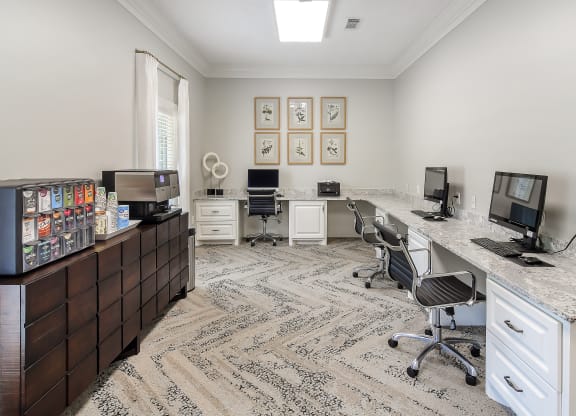 an office with two desks and two computer monitors at Bridgewater Apartment Homes, Mississippi
