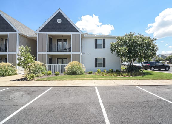 an empty parking lot in front of an apartment building at Reserve of Bossier City Apartment Homes in LA 71111