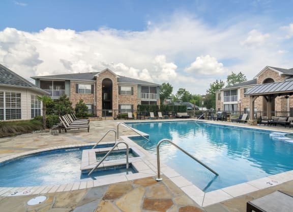 our apartments at the district feature a swimming pool at Ashford Place Apartment Homes, Flowood