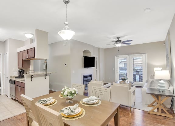 a kitchen and dining room with a table at Ashford Place Apartment Homes, Flowood, MS