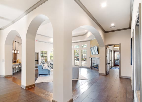a living room with archways and a large open floor plan at Audubon Park Apartment Homes, LA