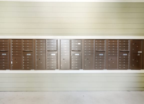 a row of lockers on the wall of a building at Audubon Park Apartment Homes, Louisiana, 70791
