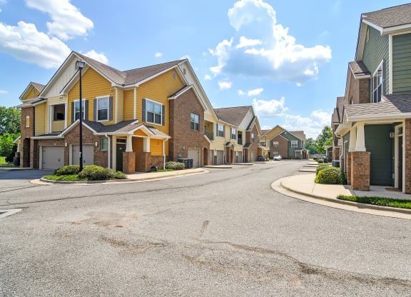 an empty street with a row of houses at Audubon Park Apartment Homes, Louisiana, 70791