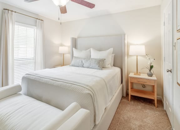 a bedroom with a bed and a ceiling fan at Cambridge Station Apartment Homes, Mississippi, 38655