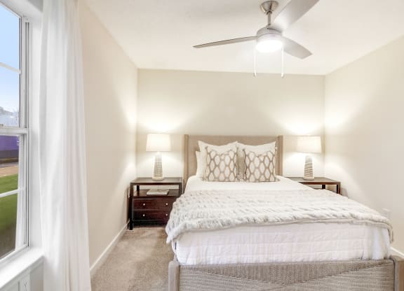 a bedroom with a bed and a ceiling fan at The Oliver Apartment Homes, Mississippi, 38654