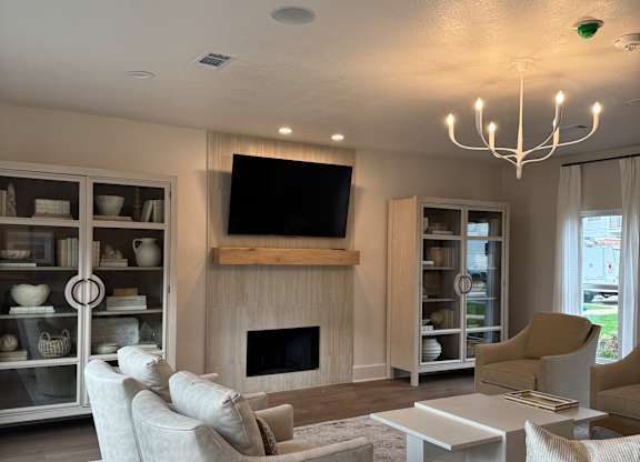 A white interior with a staircase and a window.
