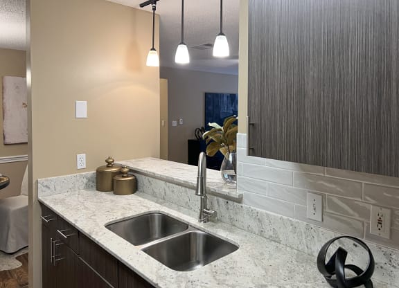 kitchen sink and light fixtures at Reserve of Bossier City Apartment Homes in Bossier City, Louisiana 71111