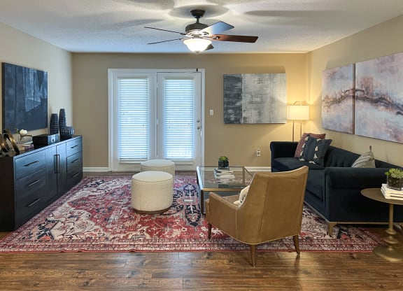 a living room with furniture and a ceiling fan at Reserve of Bossier City Apartment Homes in Bossier City, LA 71111