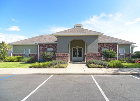 an empty parking lot in front of a house at Canebrake Apartment Homes in Shreveport, Louisiana