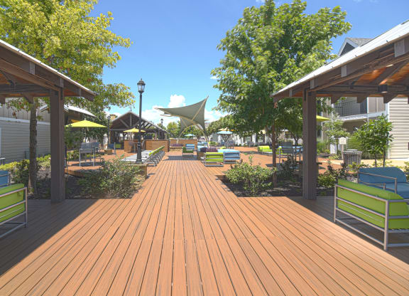 a large deck with benches and umbrellas at Reserve of Bossier City Apartments in Bossier City, LA 