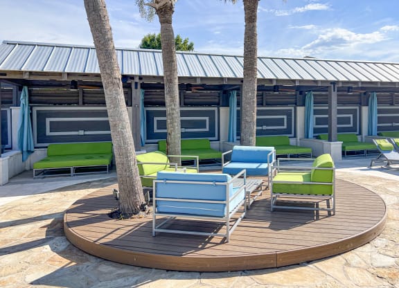 a circle of chairs and tables on a patio at Canebrake Apartment Homes in Shreveport, LA