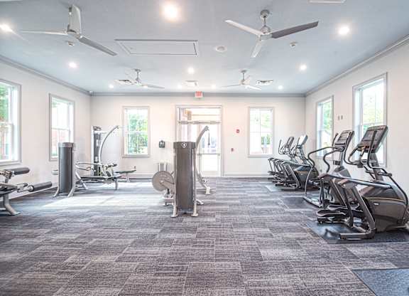 a fitness room with cardio equipment and exercise machines at Quail Ridge Apartment Homes, Bartlett, 38135