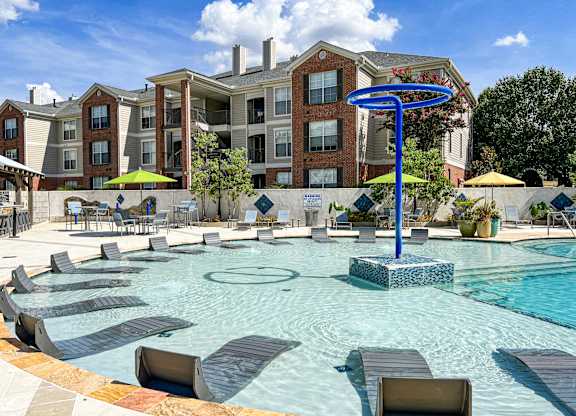 our apartments have a large pool with lounge chairs at Quail Ridge Apartment Homes, Bartlett, TN