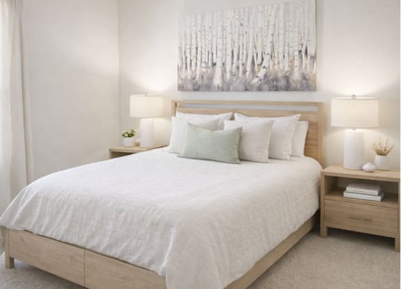 A bedroom with a large bed and a painting above it.