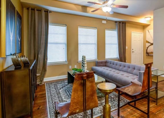 a living room with a couch and a table at The Retreat Apartment Homes in North Dakota 58801