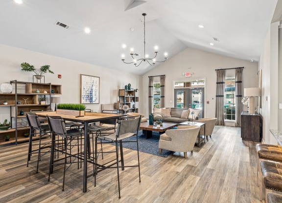 the reserve at city center spacious living room with dining table and chairs at The Met Apartment Homes, Mississippi 39402