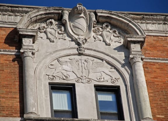 an ornate window on the side of a building