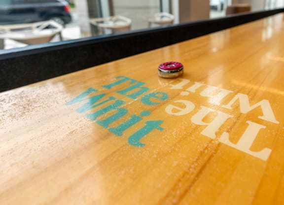 a wooden table with the big city painted on it