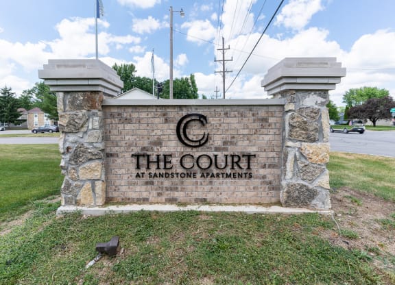 the court at banning apartments entrance sign