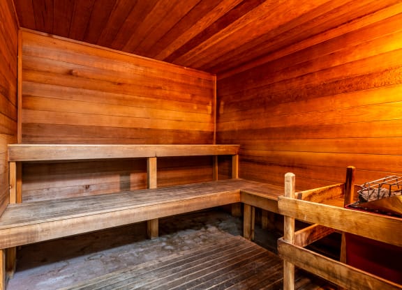 a sauna with wooden benches and wooden walls