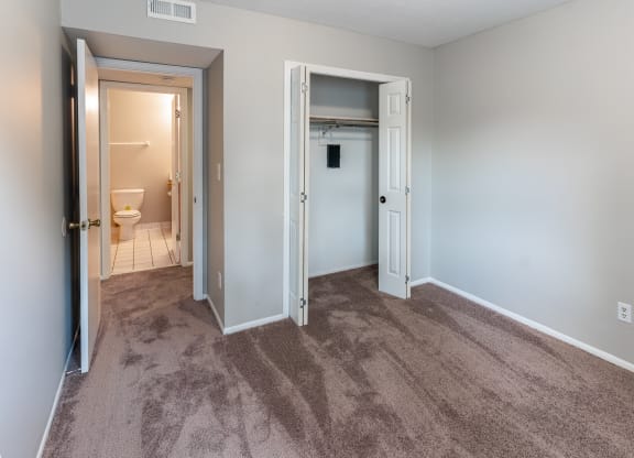 Bedroom with large closet at Crestview at Louisville Apartments, Kentucky