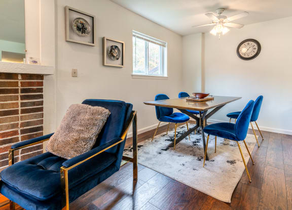a dining room with a table and chairs and a fireplace