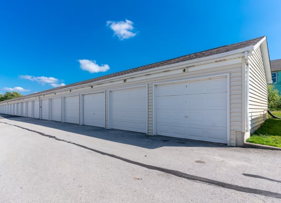 a large white garage with a long row of doors