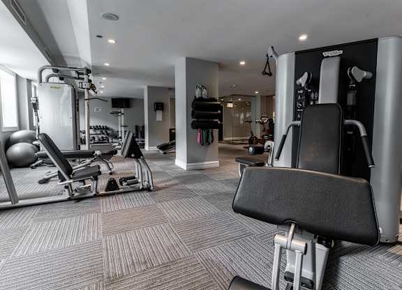 a gym with weights machines and other workout equipment