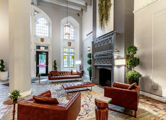 a large lobby with couches and a fireplace at Park Heights by the Lake Apartments, Chicago, 60649