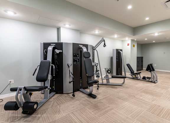 A well-equipped gym with various exercise machines. at Park Heights by the Lake Apartments, Chicago, IL