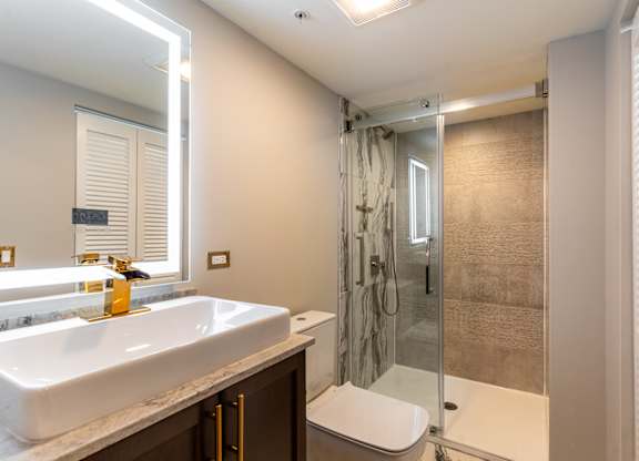 a bathroom with a sink and a shower at Park Heights by the Lake Apartments, Chicago, Illinois