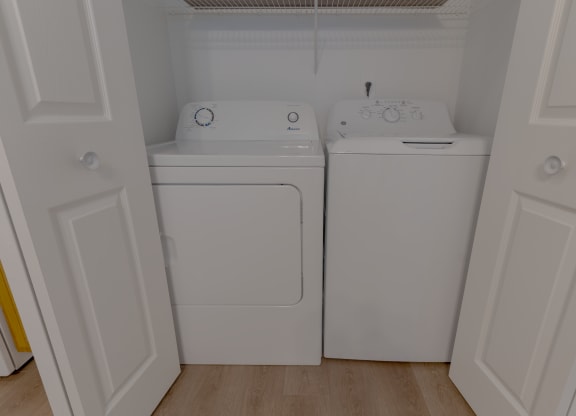 a washer and dryer in the laundry room of a home