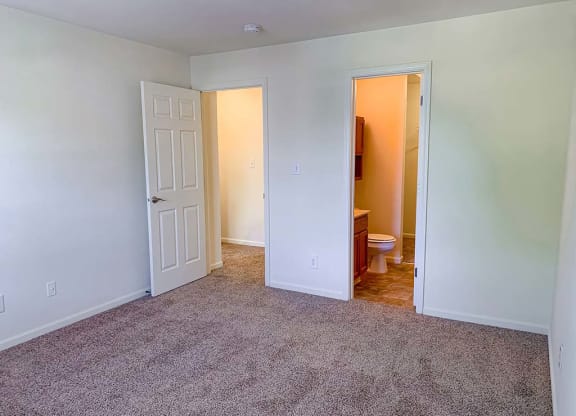 Spacious master bedroom with bathroom and walk-in closet at Bexley Village, Indiana, 46143