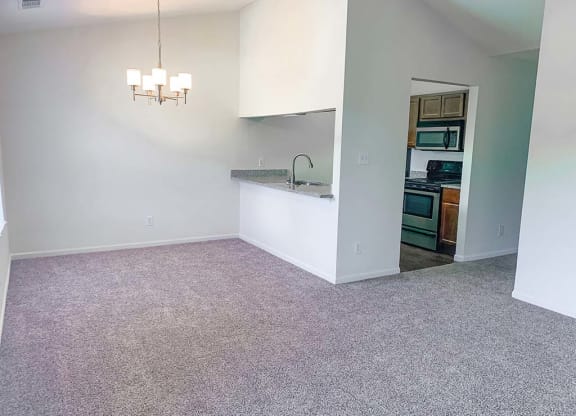 Large dining room with kitchen bar at Bexley Village, Indiana