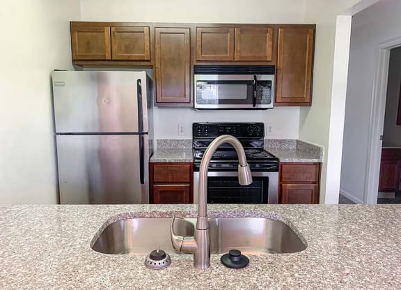 Large kitchen with stainless steel appliances at Bexley Village, Greenwood