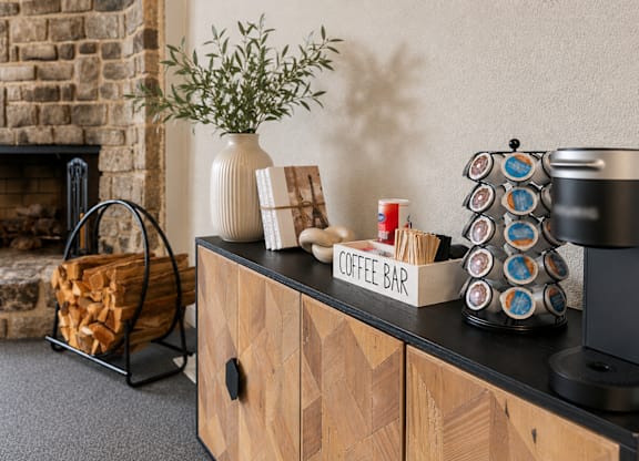 A coffee bar with a sign on it.