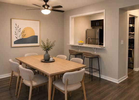 A dining room with a wooden table and chairs.