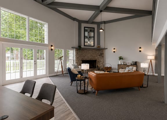 A modern living room with a fireplace and a large bed.
