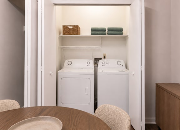 A laundry room with a washer and dryer.