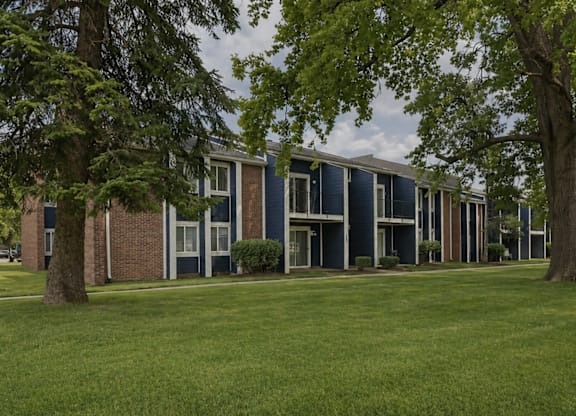 A row of houses with blue siding and white trim.