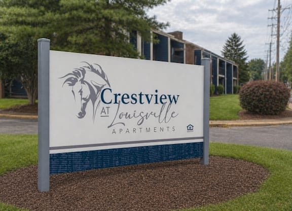 A sign for Crestview Apartments in Louisville stands in front of a building.
