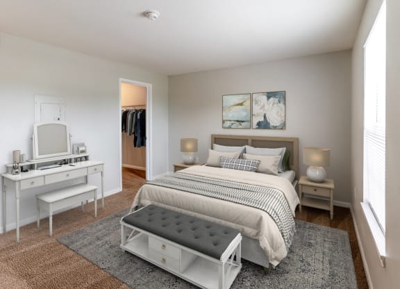 a bedroom with a bed and a dresser and a mirror