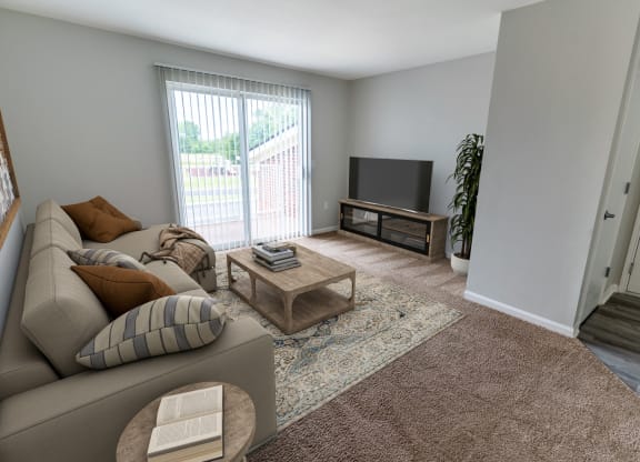 an open living room with a couch and a tv